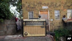 An old radio is placed outside Ngwiza Khumbulani Moyo's home in Bulawayo on February 15, 2023. (AP Photo/Tsvangirayi Mukwazhi)
