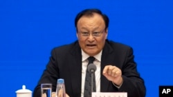 Shohrat Zakir, chairman of China's Xinjiang Uighur Autonomous Region speaks during a press conference in Beijing Monday, Dec. 9, 2019. (AP Photo/Ng Han Guan)