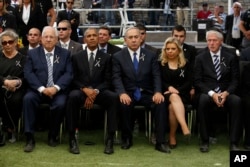 Barack Obama, Israeli Prime Minister Benjamin Netanyahu sit during the funeral of former Israeli President Shimon Peres.