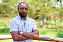 Rwandan veterinarian Olivier Nsengimana is at the Umusambi Village, a place for endangered grey crowned cranes in Kigali, Rwanda June 21, 2021. (REUTERS/Cedric Karemangingo)