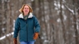 Judy Sandler was diagnosed with ADHD in her 50s. In this photo, she walks in the woods near her home in Lincolnville, Maine, January 23, 2025. (AP Photo/Robert F. Bukaty)