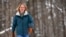 Judy Sandler was diagnosed with ADHD in her 50s. In this photo, she walks in the woods near her home in Lincolnville, Maine, January 23, 2025. (AP Photo/Robert F. Bukaty)