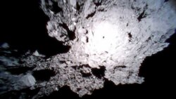 This Oct. 26, 2018, image captured by Rover-1A, and provided by the Japan Aerospace Exploration Agency (JAXA) on Thursday, Dec. 13, 2018, shows the surface of asteroid Ryugu. (JAXA via AP)