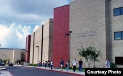 Students walk past the Solomon Coles Classroom Building on the Del Mar College campus.