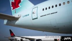 Avions d’Air Canada à l’aéroport Roissy-Charles de Gaulle, près de Paris, France, le 6 août 2018 . (Photo Joel Saget/AFP)