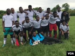 Soccer team pose for a photo before a crucial match ...