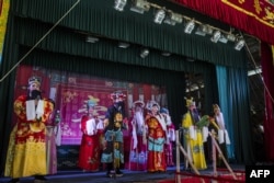 The wings are to the right and left of the stage. The audience can't see performers waiting in the wings. Here, Chiu Chow Opera performers sing on stage as part of the Hungry Ghost Festival in Hong Kong.