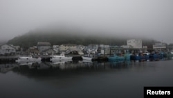 A heavy shroud of morning mist fills a port in Rausu, Hokkaido, Japan, July 2, 2019. (Reuters)