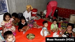 Some Rohingya women and children in an unidentified refugee colony in West Bengal, eastern India in April 2018.