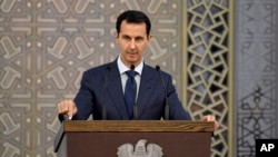 Le président syrien Bachar al-Assad s'adressant aux diplomates syriens, à Damas, en Syrie, le 20 Août, 2017.