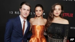Dylan Minnette, Exec. Producer Selena Gomez and Katherine Langford seen at Netflix '13 Reasons Why' Premiere at Paramount Studios on Thursday, March 30, 2017, in Los Angeles, CA. (Photo by Eric Charbonneau/Invision for Netflix/AP Images)