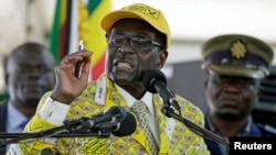 FILE: Zimbabwe's President Robert Mugabe addresses supporters at the elective congress in Harare, Zimbabwe, Dec. 4, 2014.