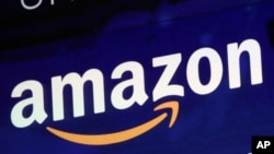 FILE - In this July 27, 2018 file photo, the logo for Amazon is displayed on a screen at the Nasdaq MarketSite. 