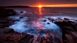 The sun's rays strike the rocky coast of Acadia National Park, in Maine, May 2, 2013. 