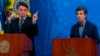 Le président brésilien Jair Bolsonaro (G) et son nouveau ministre de la Santé Nelson Teich, lors d’une conférence de presse au Palais Planalto à Brasilia, le 16 avril 2020. (AFP)