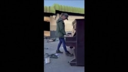 After unrest, South African pianist tackles despair through music