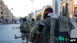 Антиурядові повстанці у центрі сирійського Алеппо, 30 листопада 2024 року. Muhammad HAJ KADOUR/AFP