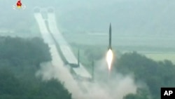 This undated picture shows several North Korean missiles being launched at once. North Korea launched four missiles on Monday. They traveled about 1,000 km. before falling into the sea.