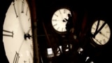 FILE - Custodian Ray Keen inspects a clock face before changing the time on the 100-year-old clock atop the Clay County Courthouse, March 8, 2014, in Clay Center, Kansas. (AP Photo/Charlie Riedel, File)