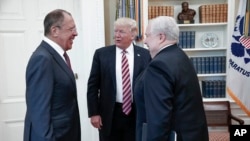 FILE - U.S. President Donald Trump meets with Russian Foreign Minister Sergey Lavrov, left, next to Russian Ambassador to the U.S. Sergei Kislyak at the White House in Washington, May 10, 2017. (Russian Foreign Ministry photo via AP) 